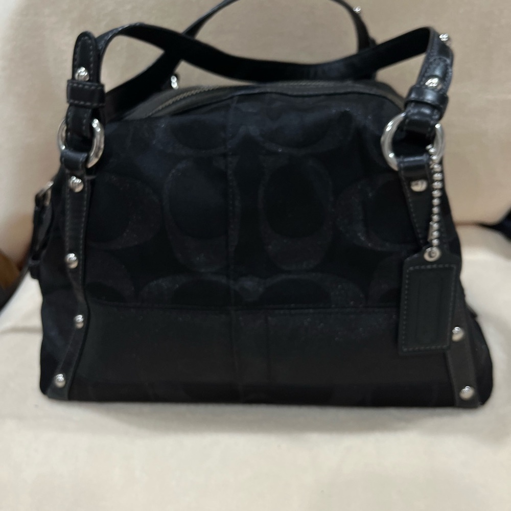 Black coach barrel bag